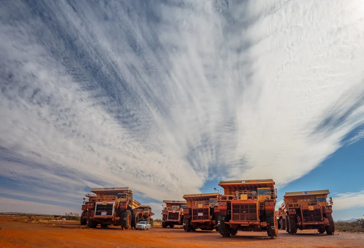 Mining trucks on an Australian site — the kind of heavy fleet operations Pollex configures Geotab for